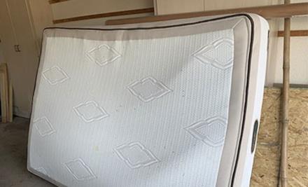 old mattress for pickup in garage